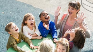 
		Teacher and children playing outdoors
	